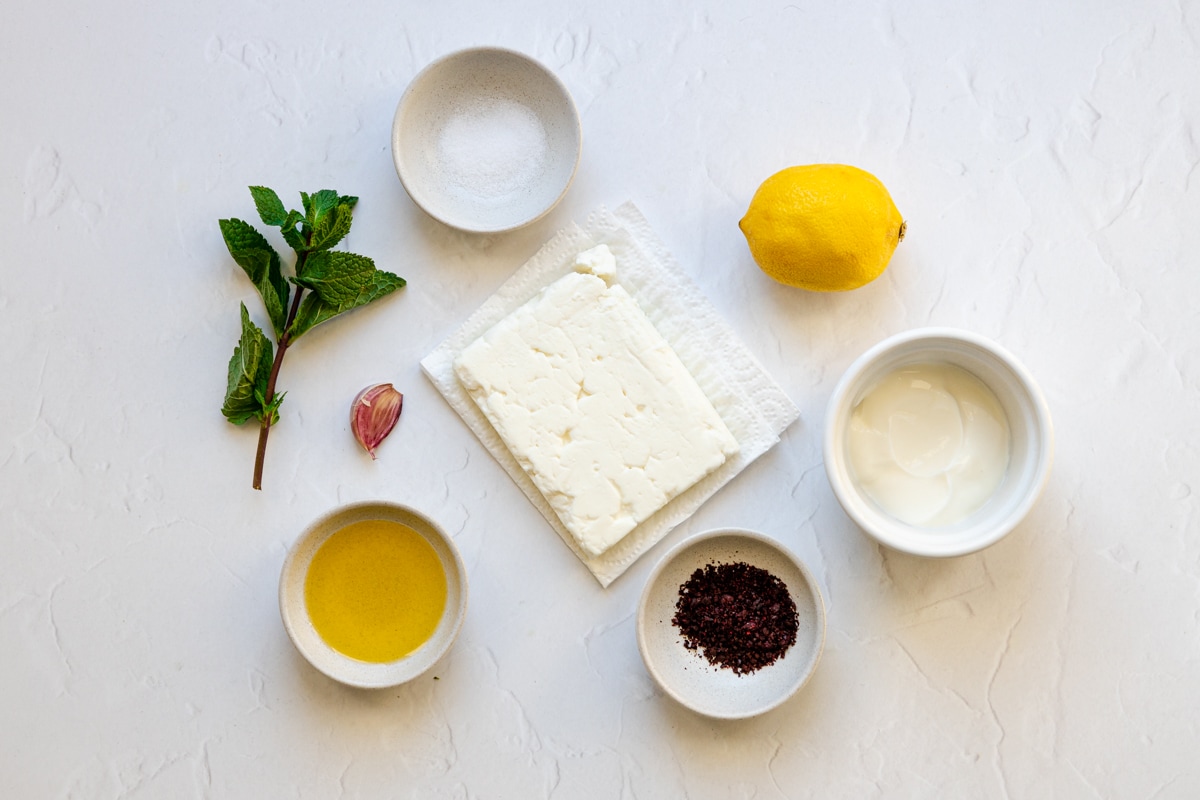 Ingredients for creamy feta lemon and sumac dip