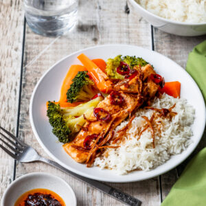 Steamed salmon, rice and veggies with a ginger garlic chilli sauce
